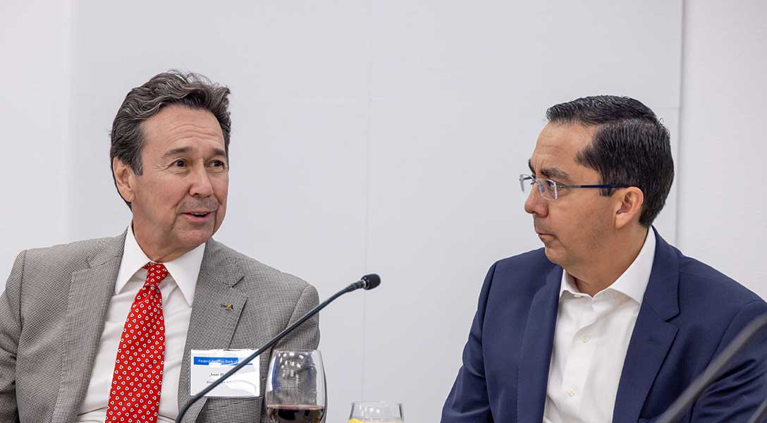 Dallas Fed Senior Vice President Roberto Coronado (right) was among the contingent that accompanied President Logan on the El Paso visit.