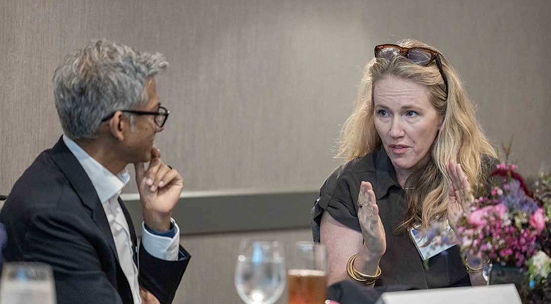 Guhan Venkatu (left), the Dallas Fed regional executive for Austin and Central Texas, listens during a roundtable discussion