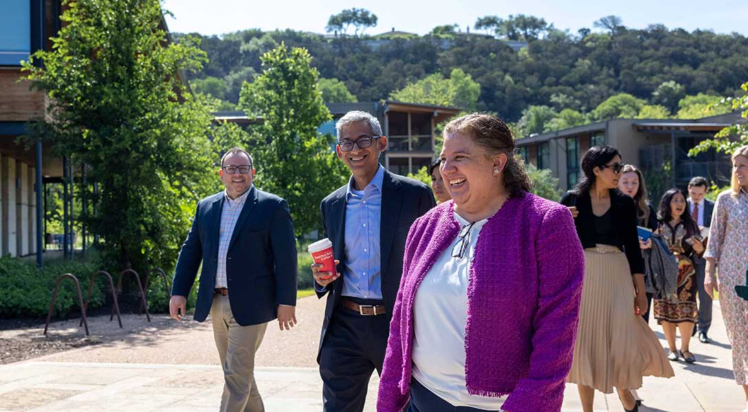 Dallas Fed regional executives Armida Riojas (right) and Guhan Venkatu tour the Holdsworth Center campus.