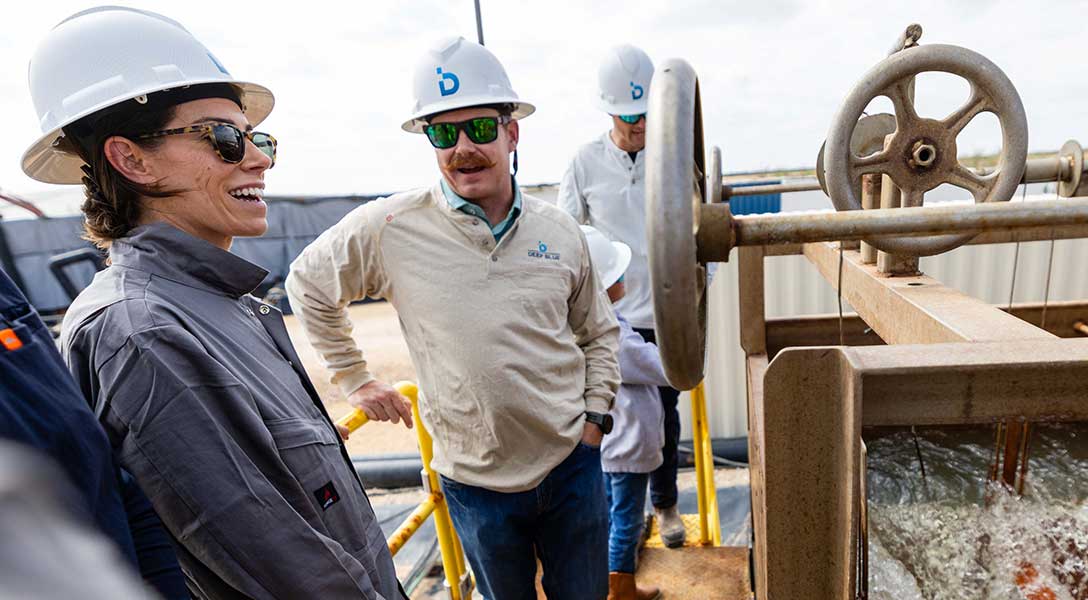 Photo of Dallas Fed leaders touring a plant that cleans water produced as a byproduct of oil drilling.