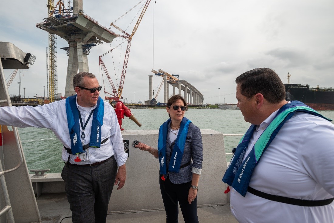 Dallas Fed President Lorie Logan talks with officials during her stop in Corpus Christi