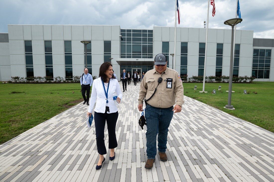 Dallas Fed President Lorie Logan talks with officials during her stop in Corpus Christi