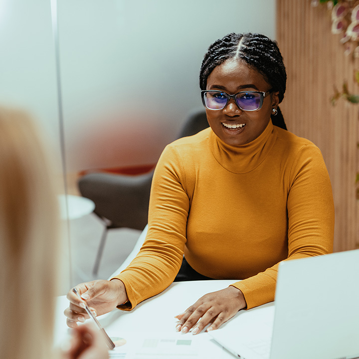 Woman smiling at desk